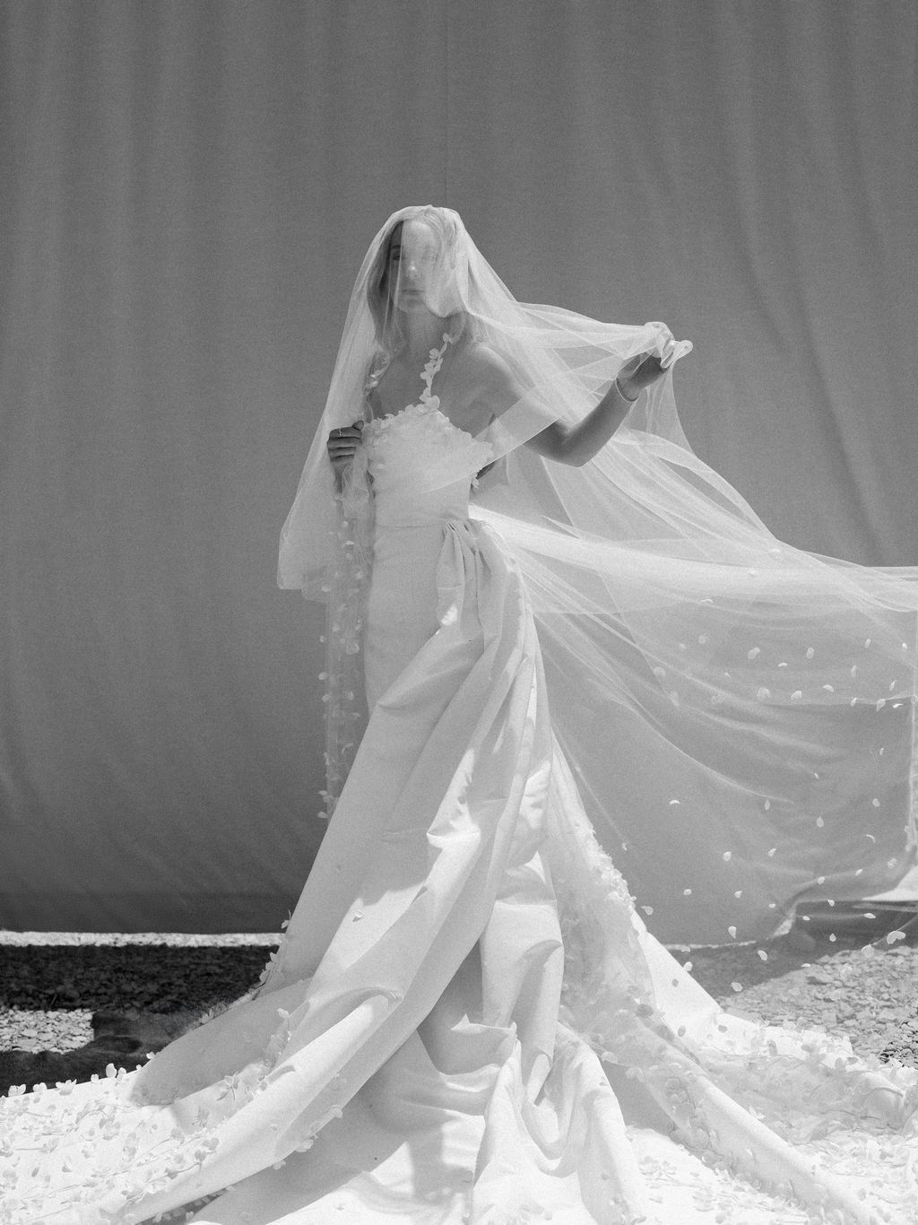 Image may contain Clothing Dress Fashion Formal Wear Gown Wedding Wedding Gown Face Head Person and Photography