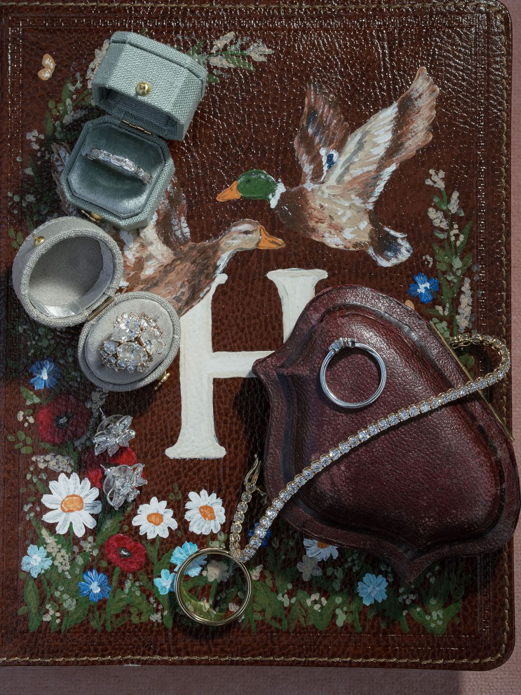 Image may contain Accessories Jewelry Pendant Art Painting Animal Bird and Locket