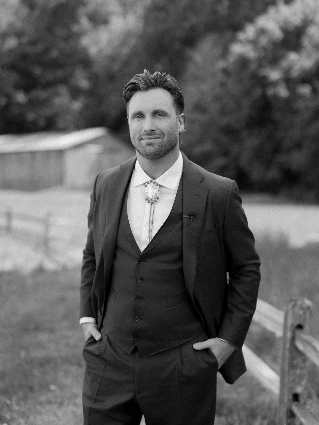 Image may contain Clothing Formal Wear Suit Tuxedo Coat Face Head Person Photography Portrait Blazer and Jacket
