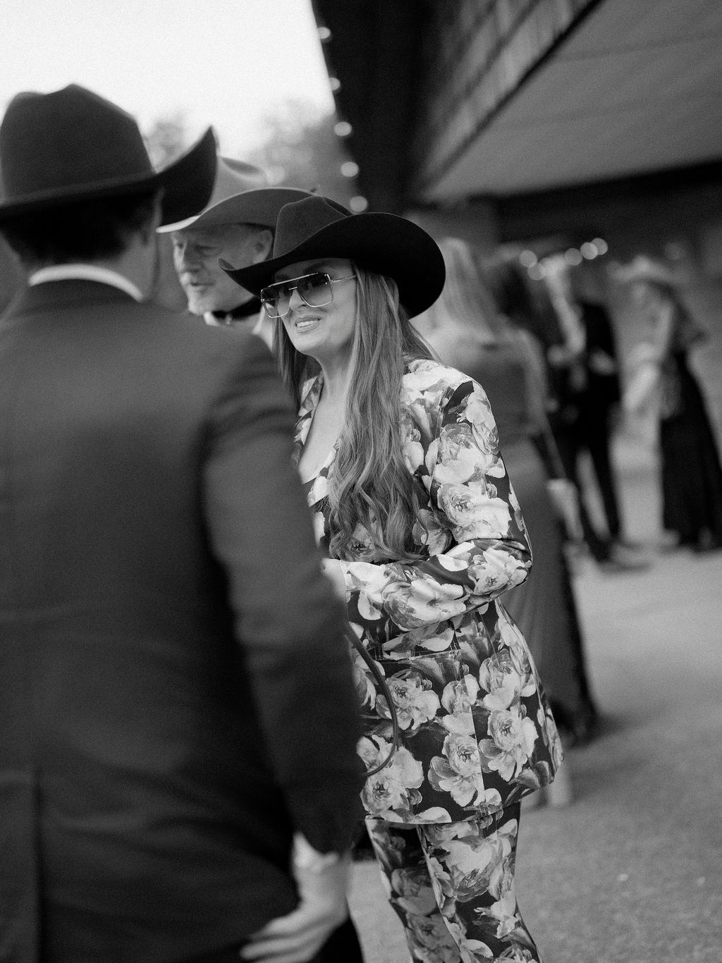 Image may contain Wynonna Judd Clothing Hat Sun Hat Coat Adult Person Formal Wear Face Head and Accessories