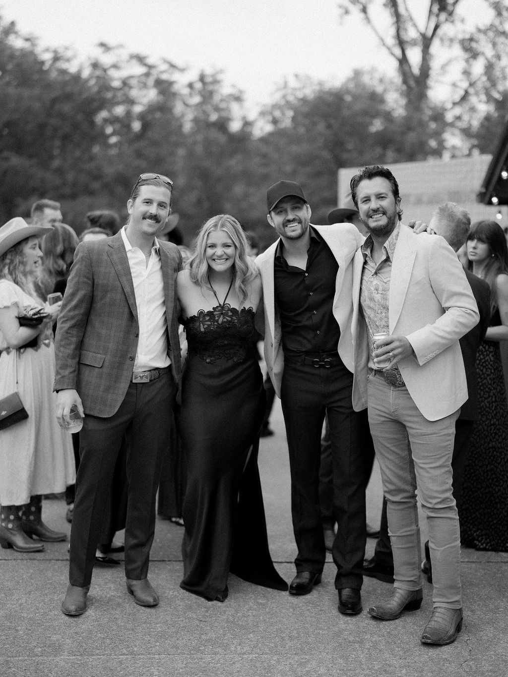 Image may contain Luke Bryan Lauren Alaina Uschi Obermaier Clothing Formal Wear Suit Blazer Coat Jacket and People