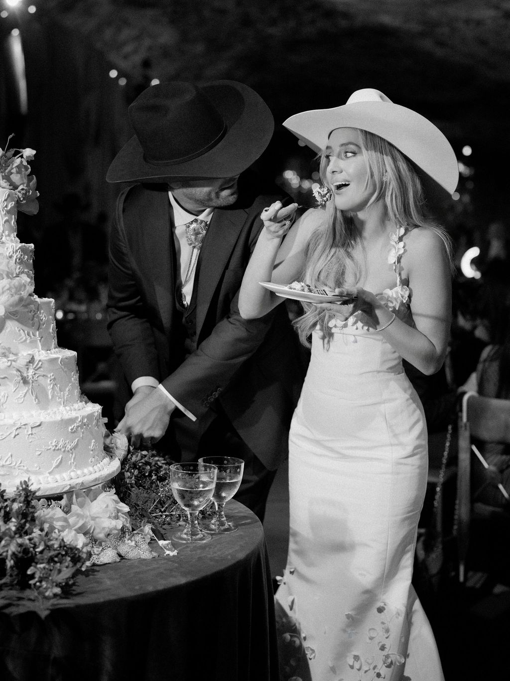 Image may contain Clothing Dress Hat Cake Dessert Food Adult Person Wedding Formal Wear Suit and Wedding Cake