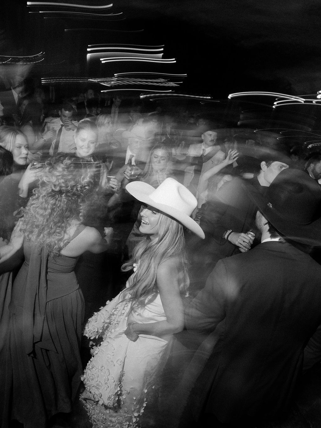 Image may contain David Dalton Clothing Hat Dress Adult Person Formal Wear Wedding Urban Face and Head