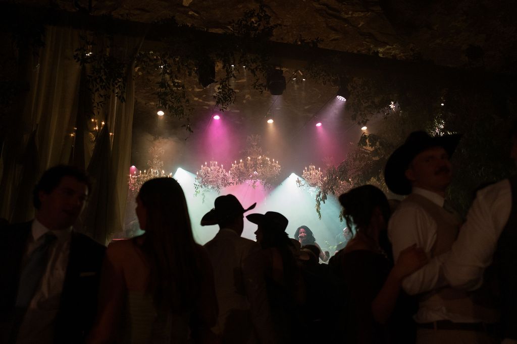 Image may contain Lighting Concert Crowd Person Urban Club Adult Night Club Clothing Hat Night Life and Face