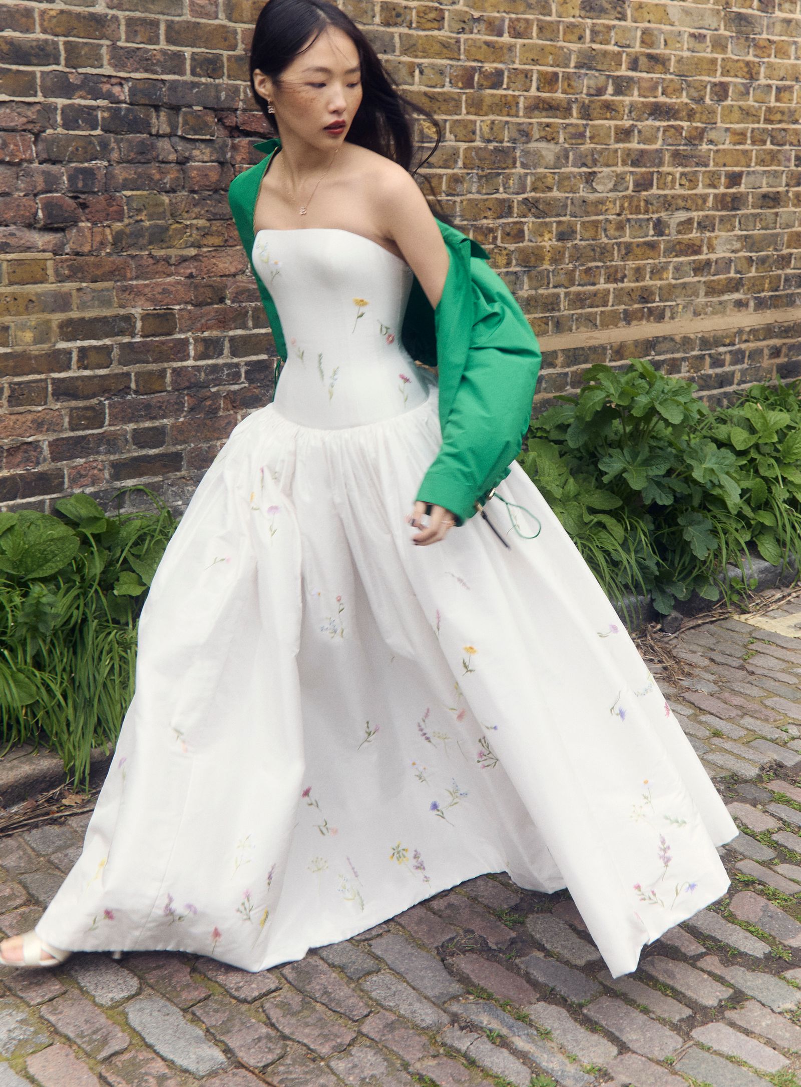 Image may contain Clothing Dress Fashion Formal Wear Gown Wedding Wedding Gown Evening Dress Sleeve and Adult