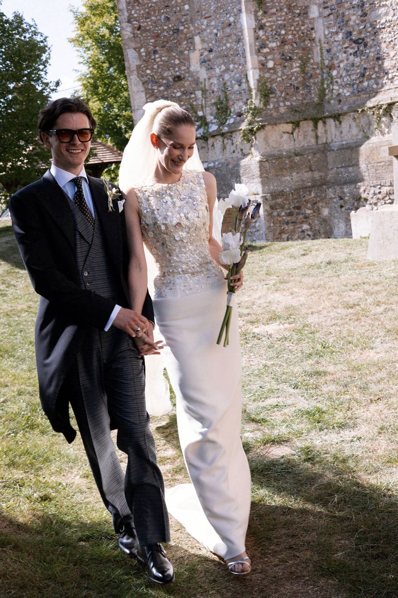 Image may contain Blazer Clothing Coat Jacket Formal Wear Suit Dress Fashion Gown Wedding and Wedding Gown