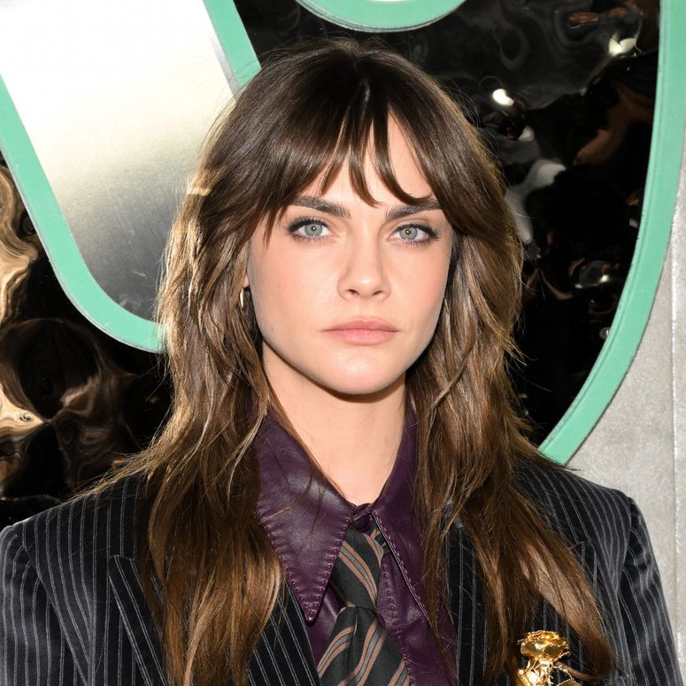 Image may contain: Cara Delevingne, Accessories, Formal Wear, Tie, Adult, Person, Face, Head, Photography, and Portrait