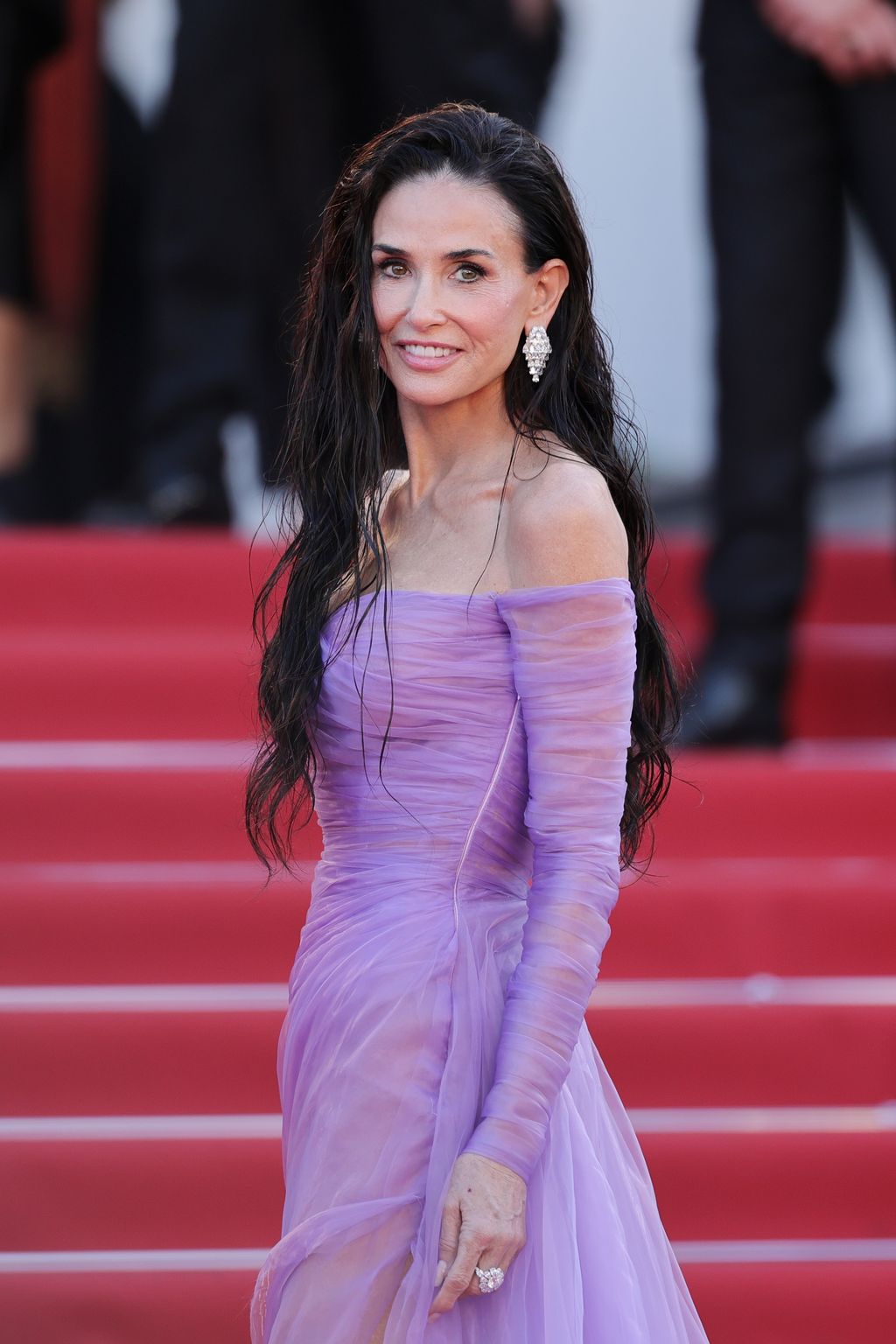 Image may contain Demi Moore Black Hair Hair Person Face Happy Head Smile Dimples Fashion and Adult
