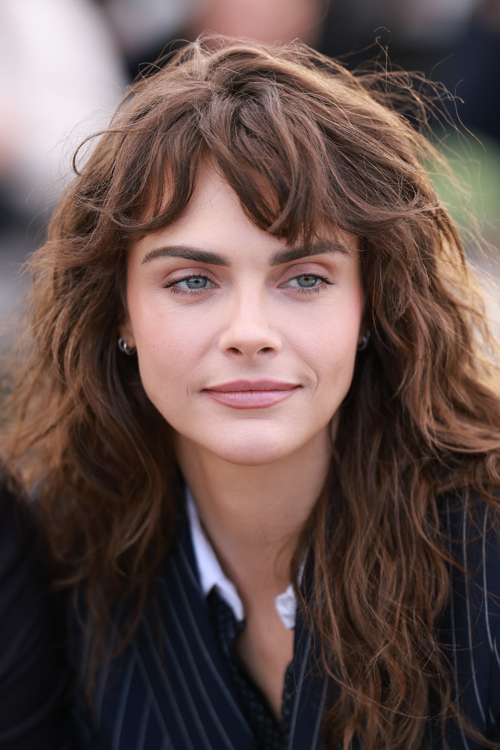 Image may contain Cara Delevingne Head Person Face Photography Portrait Happy Smile Teen Body Part and Neck