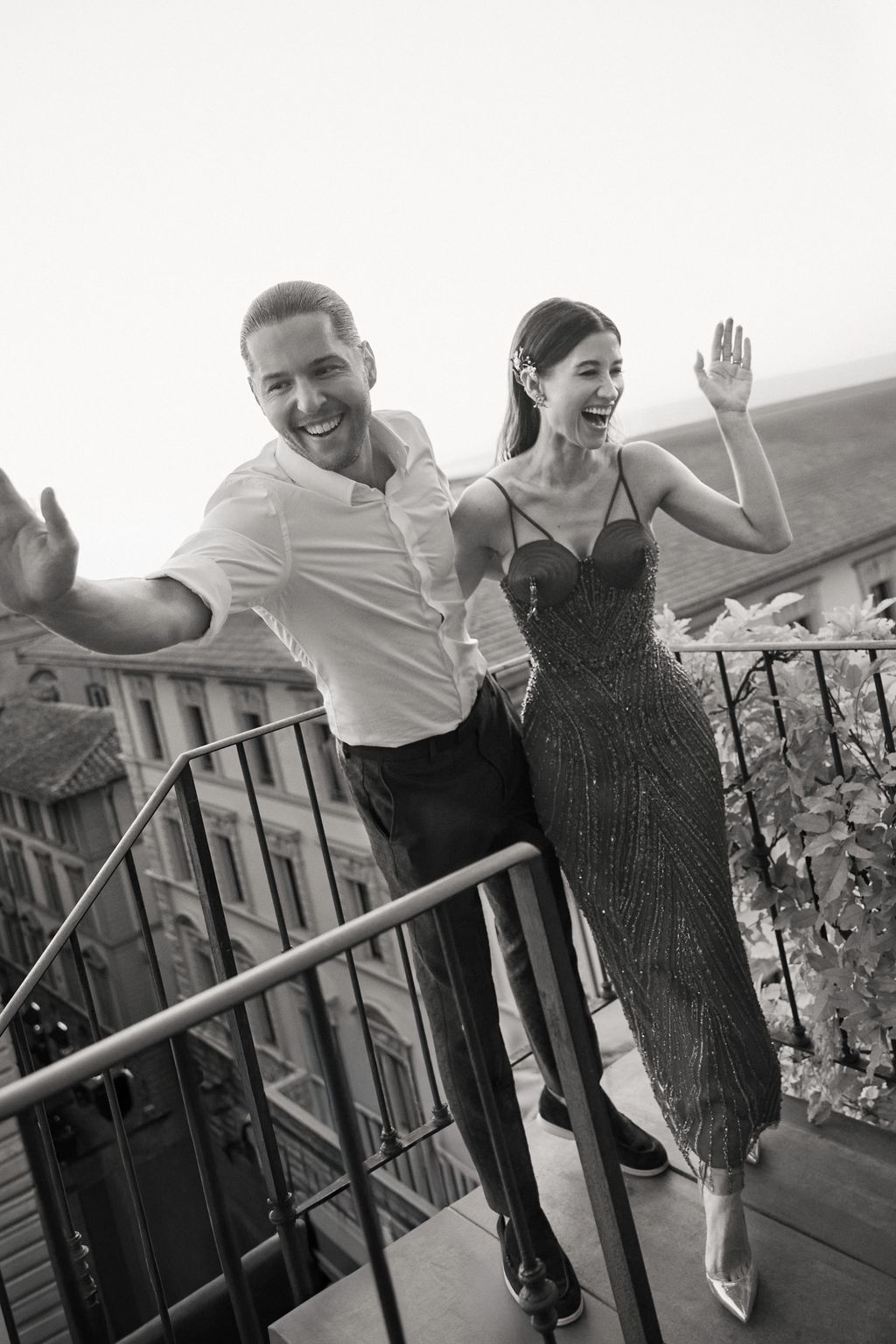 Image may contain Face Head Person Photography Portrait Clothing Dress Railing Handrail Adult and Body Part
