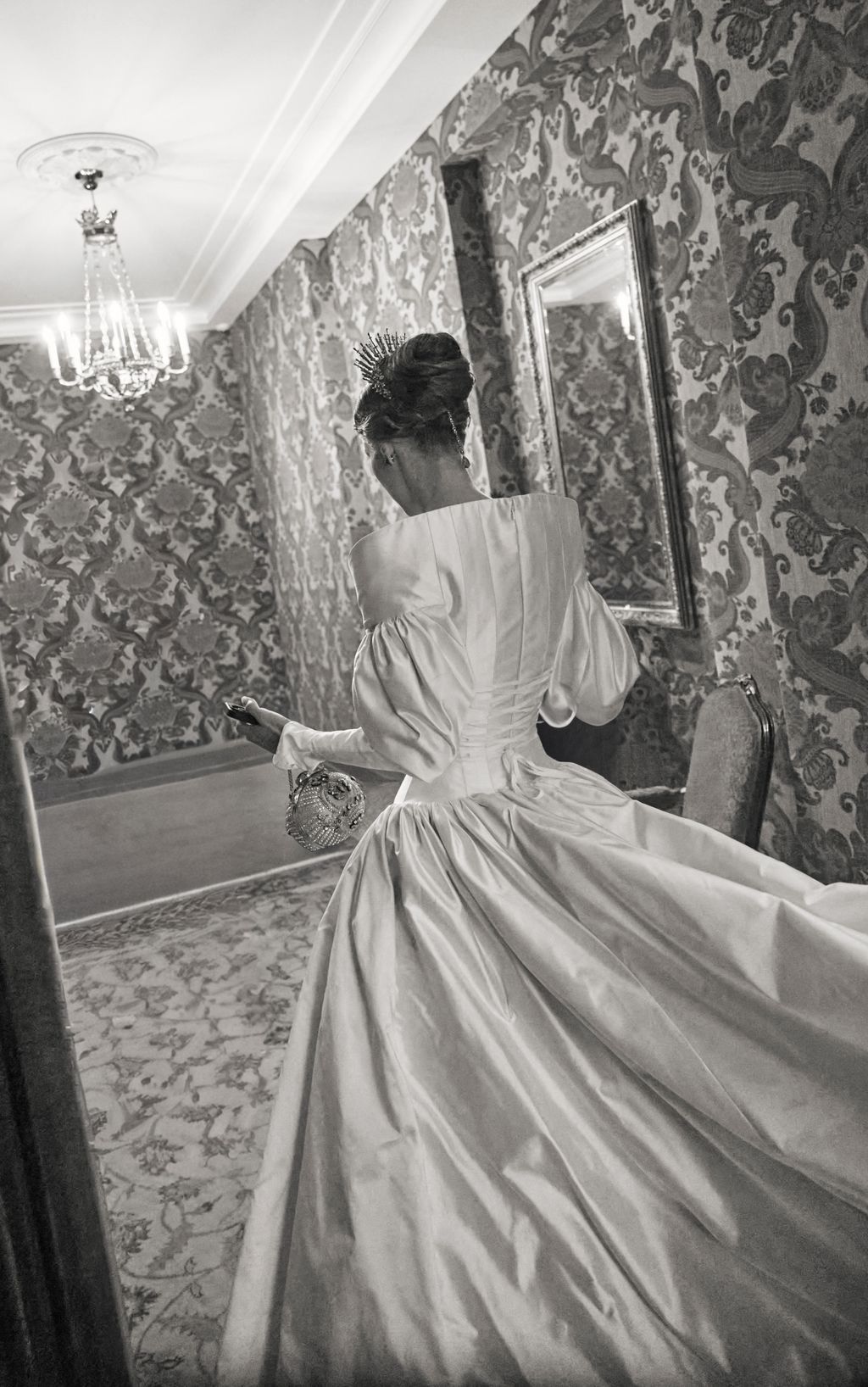 Image may contain Clothing Dress Chandelier Lamp Formal Wear Fashion Gown Wedding Wedding Gown Adult and Person