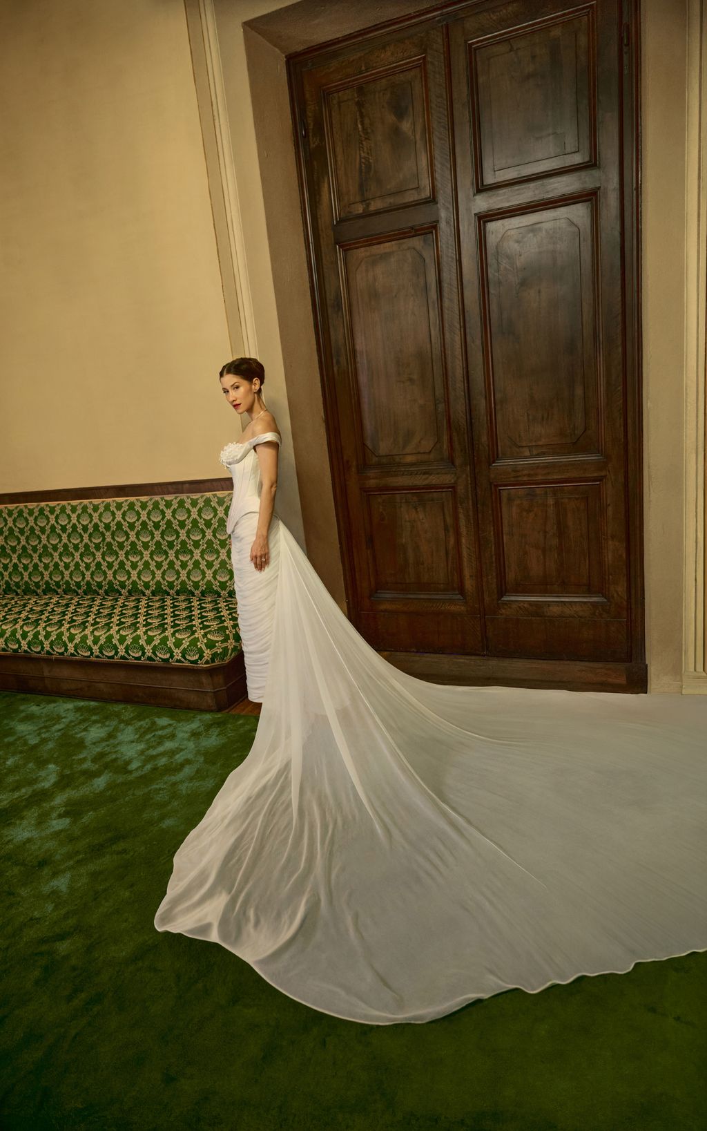Image may contain Clothing Dress Fashion Formal Wear Gown Wedding Wedding Gown Person Adult and Door