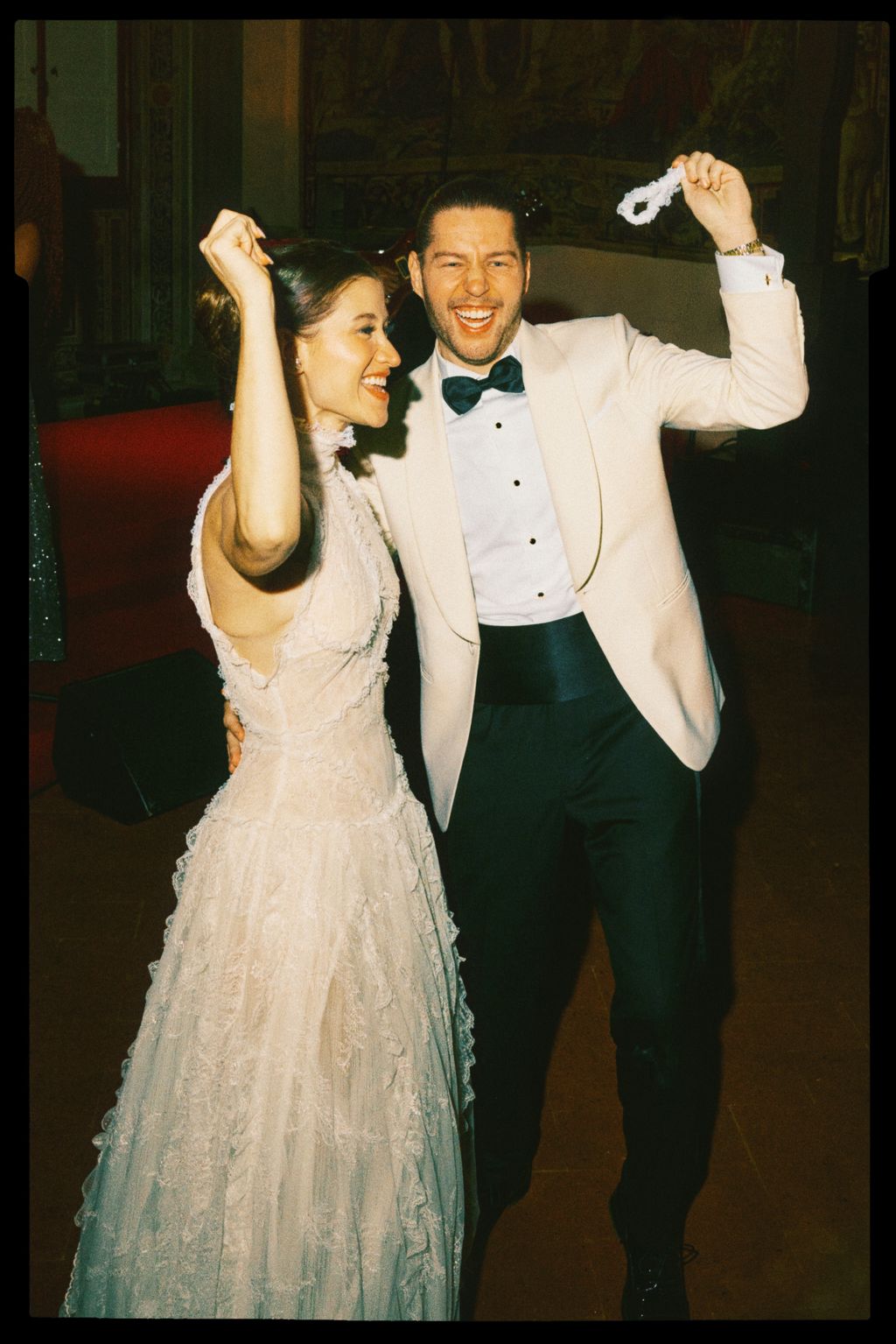 Image may contain Clothing Formal Wear Suit Blazer Coat Jacket Face Head Person Photography Portrait and Dress