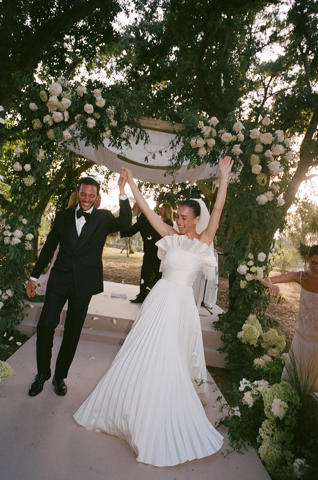Image may contain Clothing Formal Wear Suit Dress Fashion Gown Wedding Wedding Gown Face Head and Person
