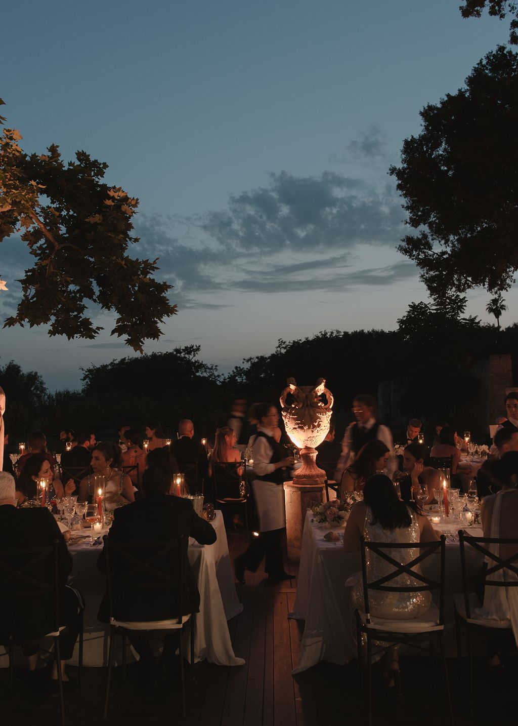 Image may contain Indoors Adult Person Chair Furniture Hall Wedding Fun Dining Table Table and Architecture