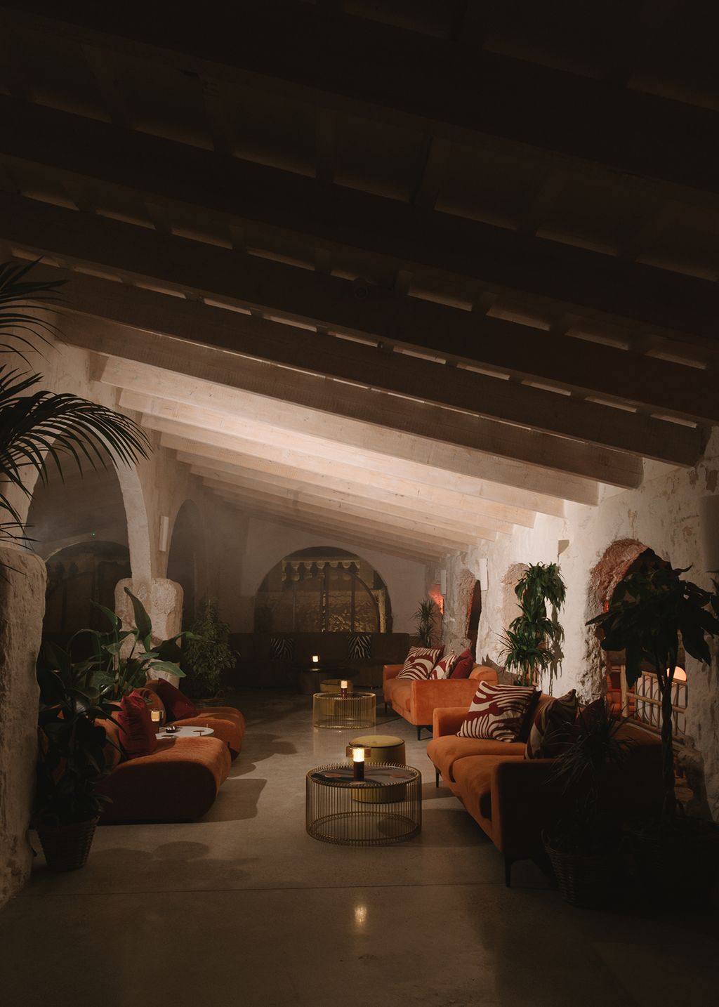 Image may contain Architecture Building Furniture Indoors Living Room Room Couch Home Decor Plant and Foyer
