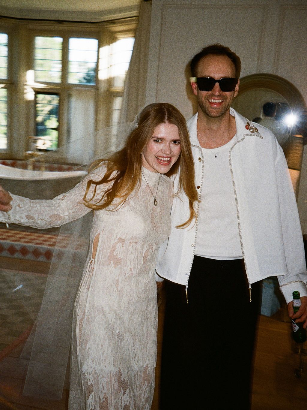 Image may contain Blouse Clothing Face Head Person Photography Portrait Photobombing Long Sleeve Sleeve and Coat