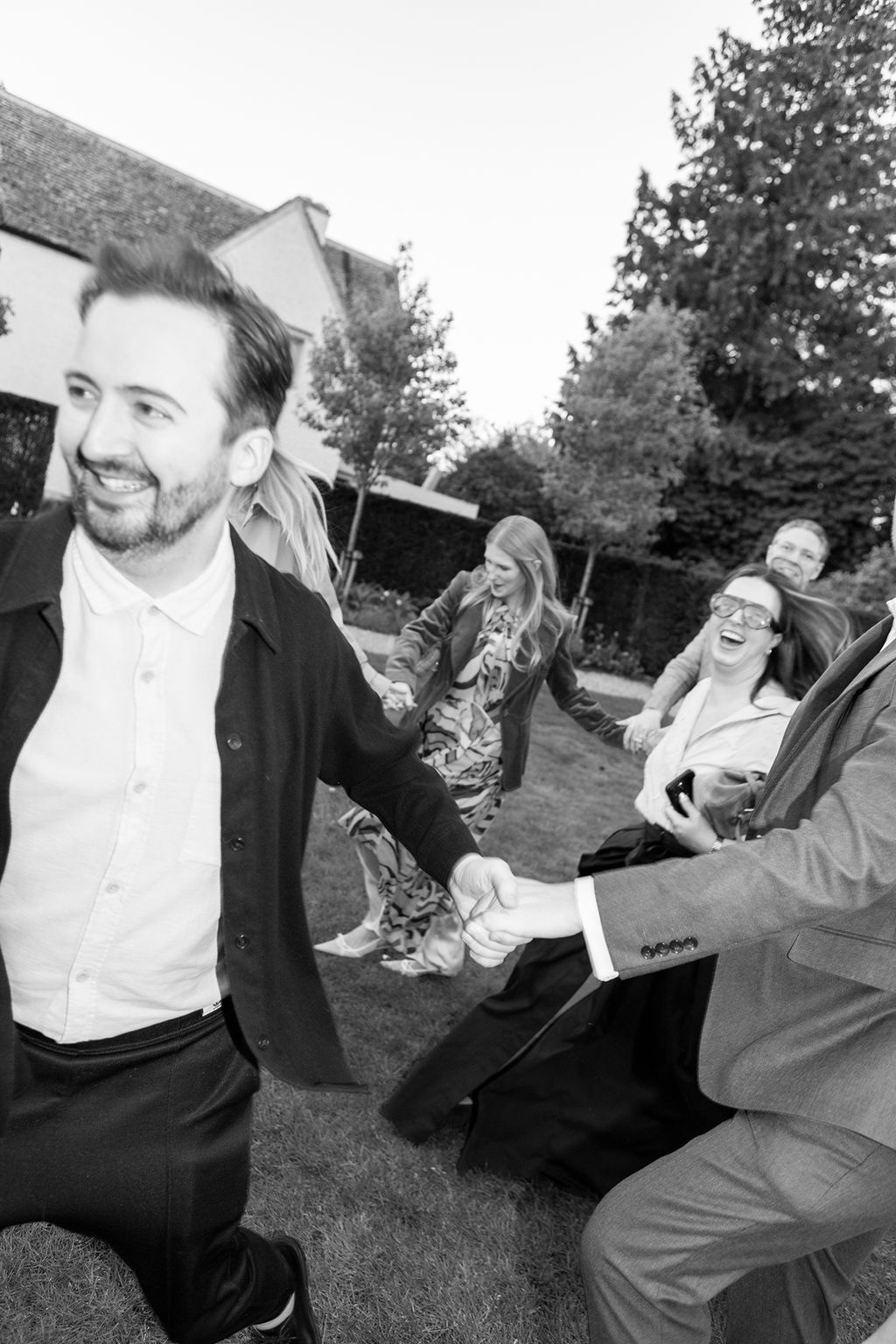 Image may contain Clothing Formal Wear Suit Face Head Person Photography Portrait Blazer Coat Jacket and Shirt