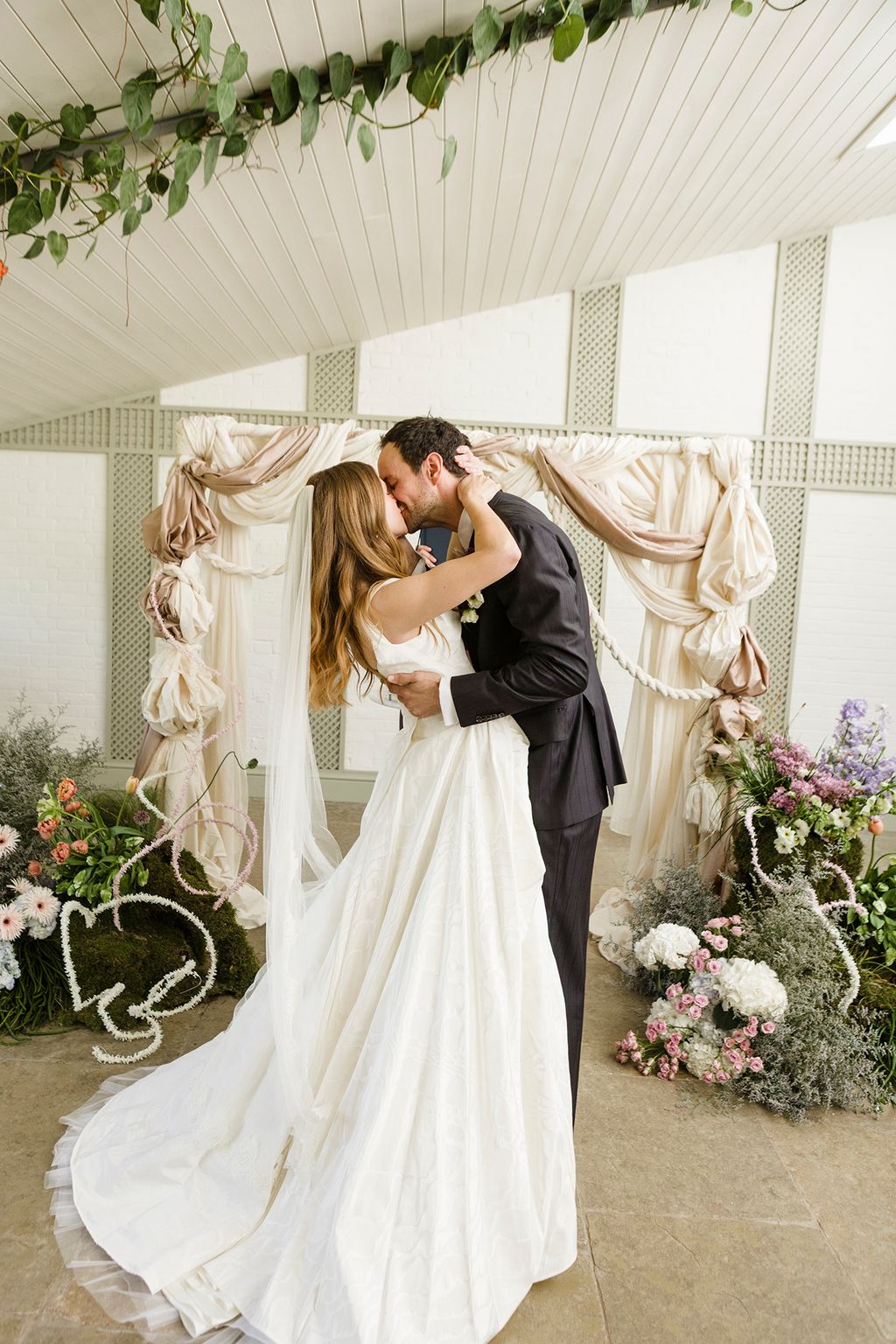 Image may contain Adult Person Wedding Plant Potted Plant Kissing and Romantic