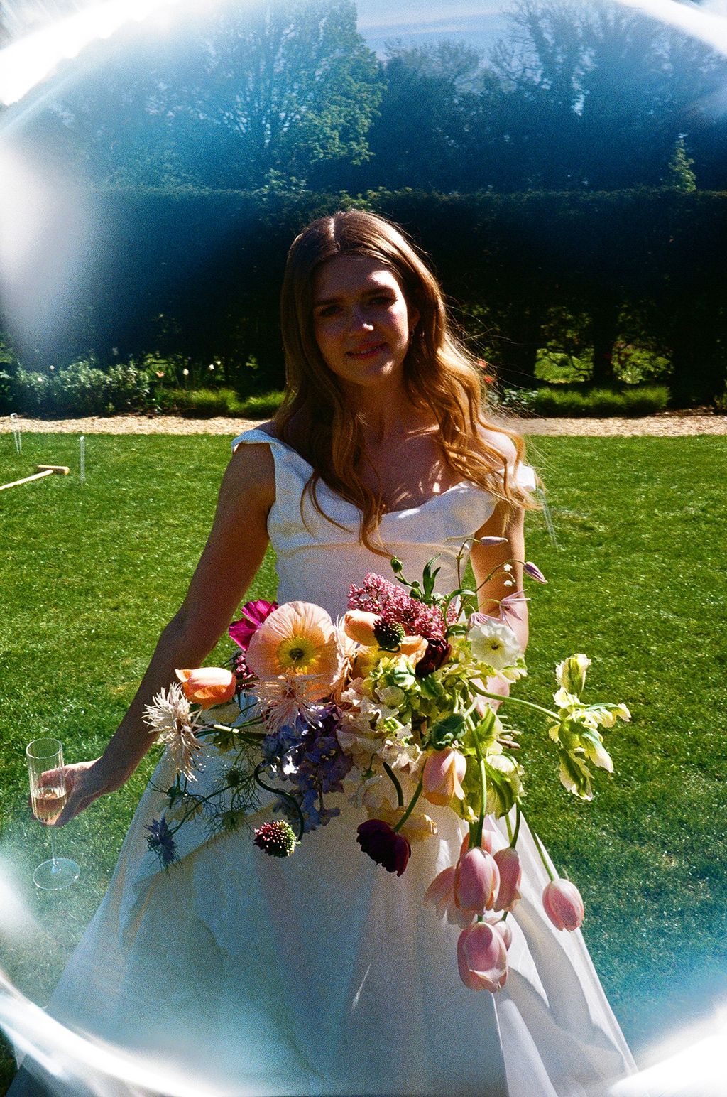 Image may contain Grass Plant Photography Face Head Person Portrait Flower Petal and Flower Arrangement