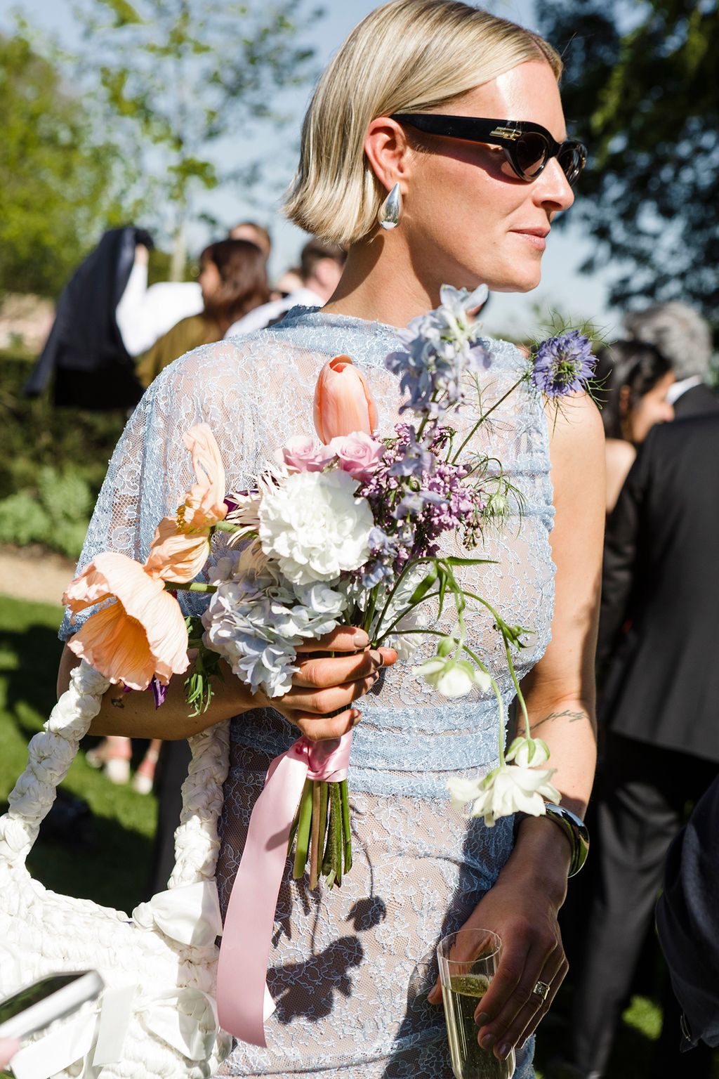 Image may contain Flower Flower Arrangement Flower Bouquet Plant Clothing Dress Fashion Formal Wear and Gown