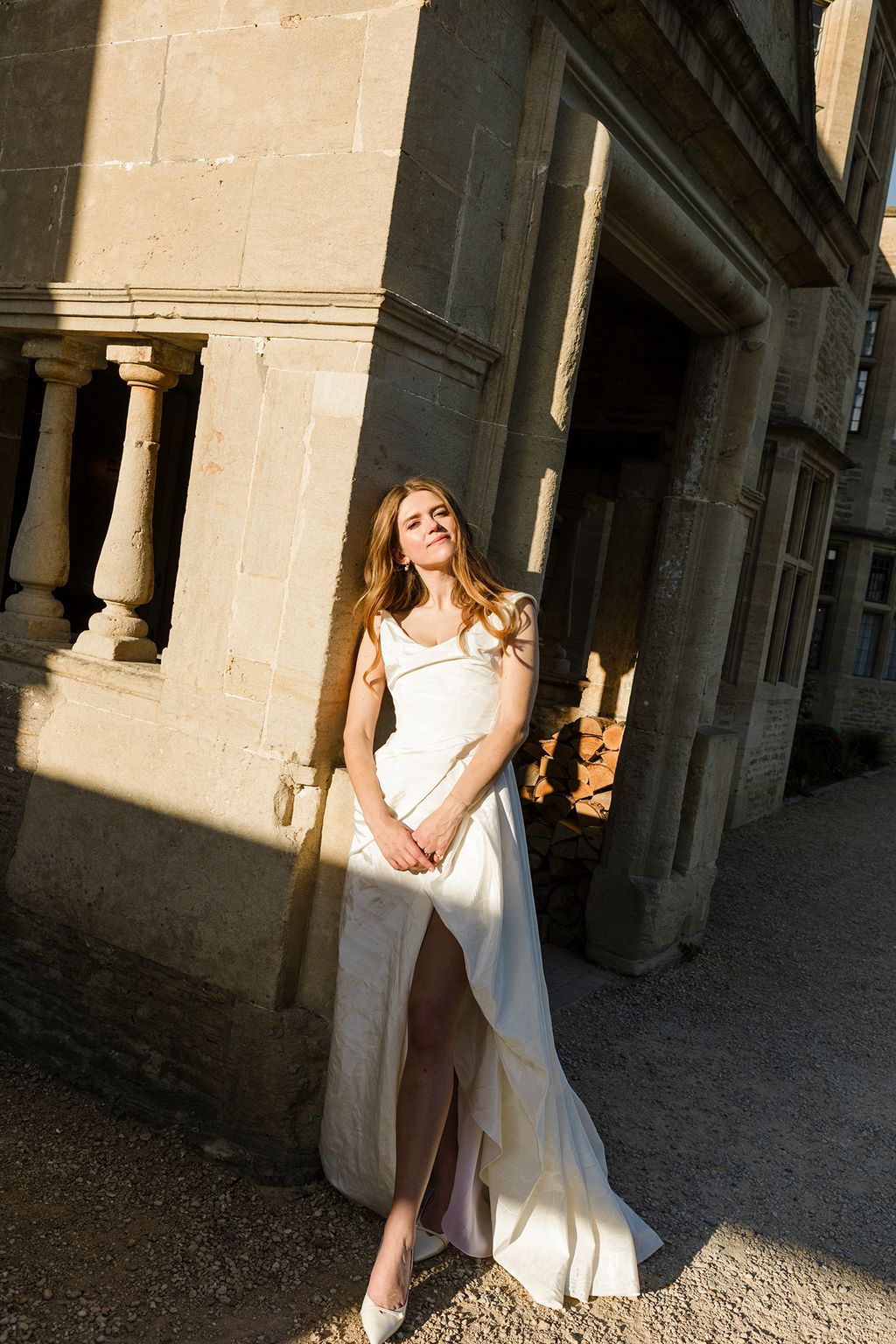 Image may contain Adult Person Clothing Dress Formal Wear Head Face and Evening Dress