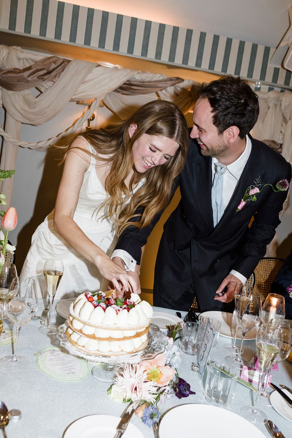Image may contain People Person Adult Wedding Fun Party Cake Dessert Food Wedding Cake Clothing and Formal Wear