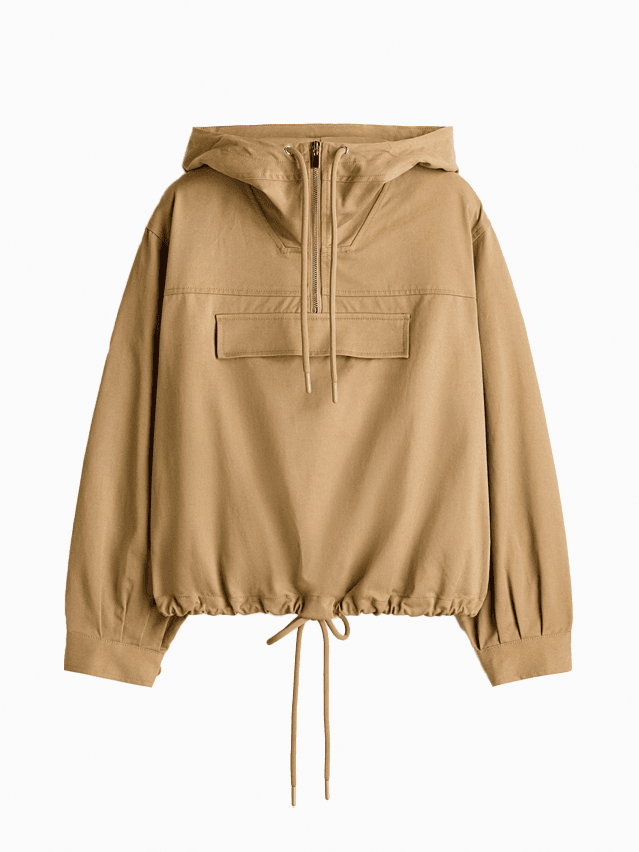 Image may contain Blouse Clothing Coat Jacket Hoodie Knitwear Sweater Sweatshirt and Khaki
