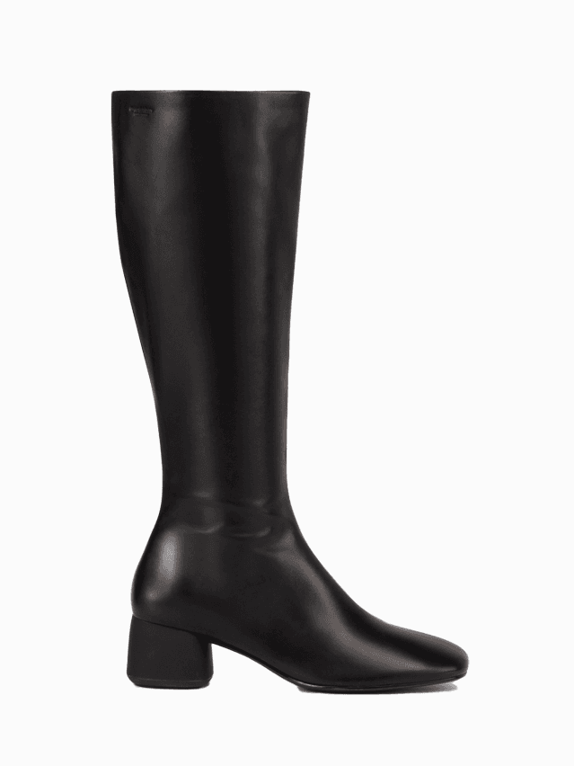 Image may contain Boot Clothing Footwear Riding Boot and Shoe